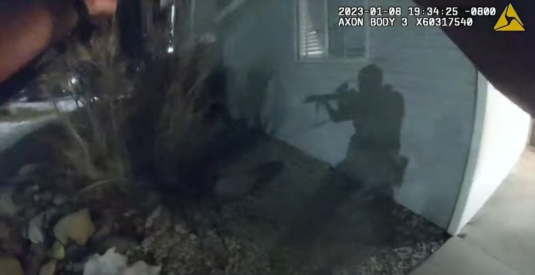 A police officer's shadow is seen in his bodycam's footage as he approaches the scene of a Jan. 8 shootout at a Reno apartment complex.