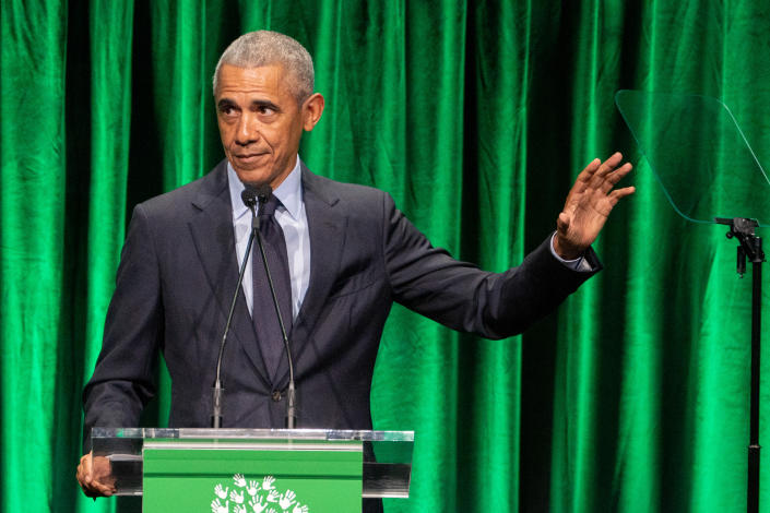 Former President Barack Obama pauses during a speech at the Sandy Hook Promise 