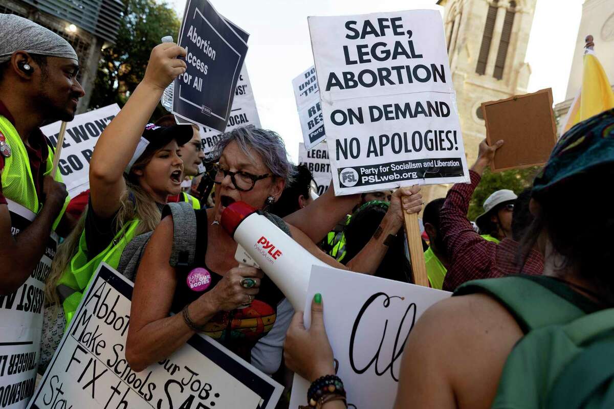 Abortion-rights advocates clash with anti-abortion supporters during a Aug. 25, 2022, rally for abortion rights held outside the municipal plaza building in San Antonio. Aug. 25 was the day that Texas’ “trigger law” went into effect after the Supreme Court ruling on abortion.