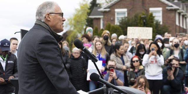 Washington state Governor Jay Inslee speaks to media and people gathered at Kerry Park about patient's rights to abortion and reproductive healthcare during a pro-choice rally in Seattle May 3, 2022.