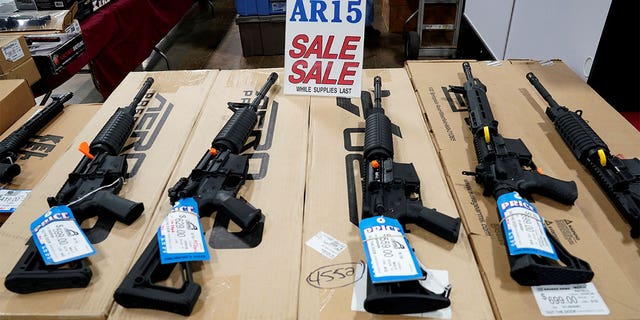 AR-15 rifles are displayed for sale at the Guntoberfest gun show in Oaks, Pennsylvania, on Oct.  6, 2017.